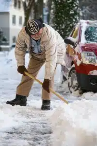 Senior Shovelling Snow Senior Shovelling Snow